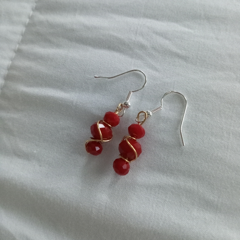 hand crafted sterling silver red crystal wire wrapped statement earrings
